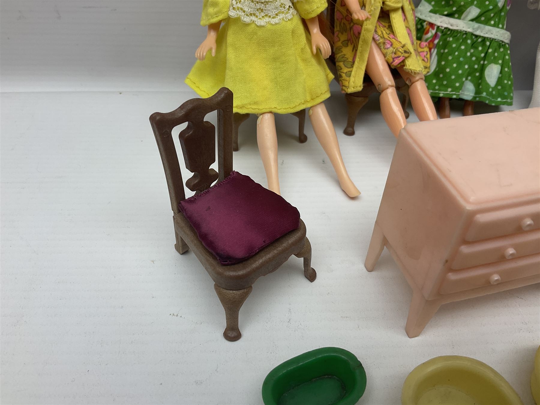 Seven Pippa dolls and a collection of plastic dolls house furniture