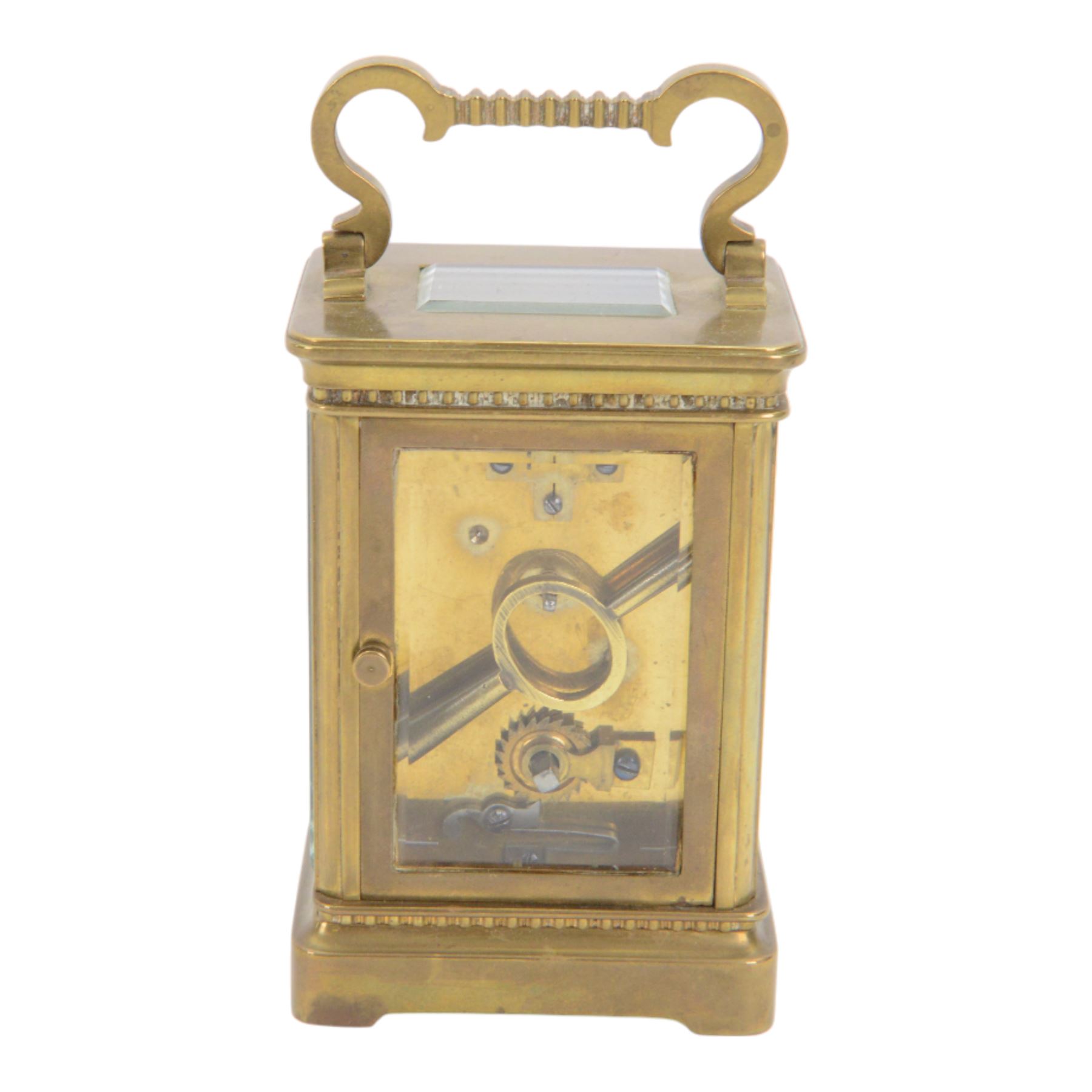 French-Edwardian 8-day timepiece carriage clock with a cylinder platform escapement, anglaise style brass case with four glass panels, dial with a polished gilt mask and foliate decoration, white enamel chapter with Arabic numerals and steel spade hands, . With Key. 