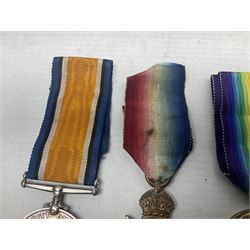 WW1 group of three medals comprising British War Medal, 1914-15 Star and Victory Medal awarded to 1781 Pte. W. Cartwright Manch. R.; and another WW1 British War Medal awarded to 30284 Pte. W.H. Paterson Manch. R.; all with ribbons (4)