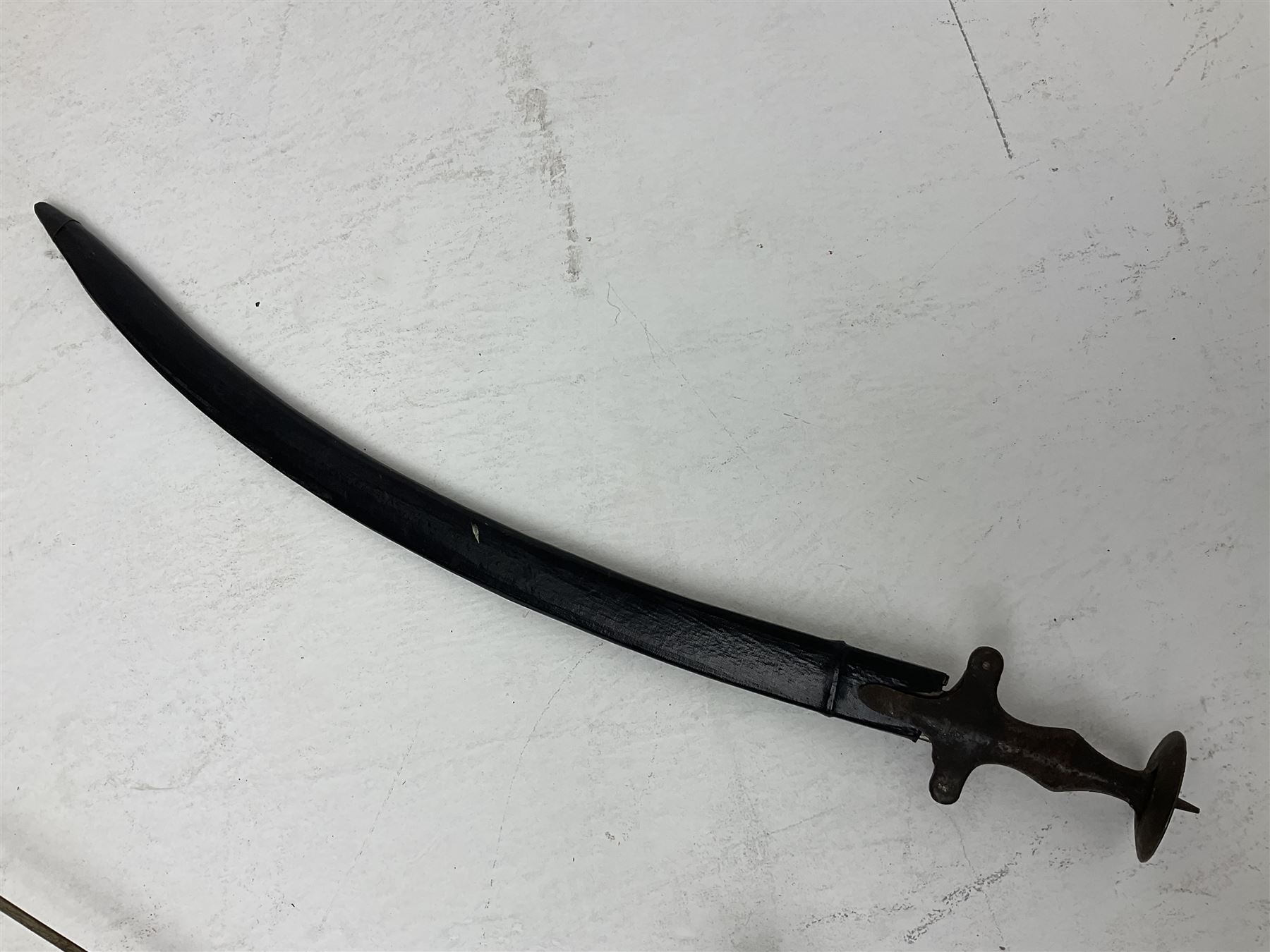 20th century Indian Tulwar sword with 71cm plain curving steel blade and iron hilt with extended langets, knopped grip and spiked pommel; in canvas covered wooden scabbard L87.5cm overall; together with five fencing swords comprising four foils and one epee, three marked Leon Paul, one in carrying case (6)