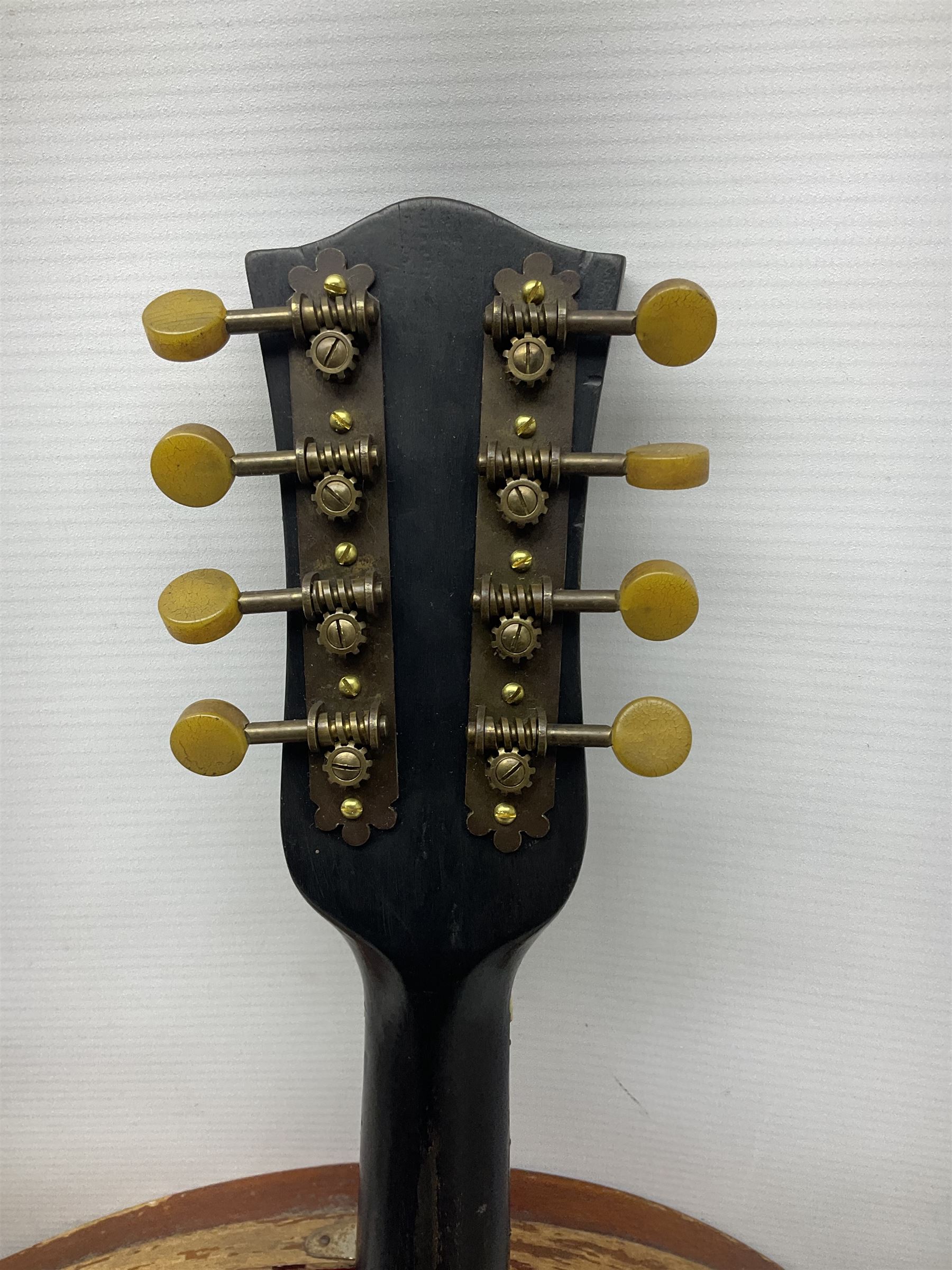 Early 20th century Italian Rafaele Disantino eight-string mandolin with two-piece back and spruce top with stamped Rafaele Disantino signature; bears maker's label L61cm; in wooden carrying case