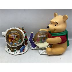 Six Disney Winnie the Pooh Christmas snow globes, comprising large Mr Christmas Holiday Snowfall, An Enchanted Christmas, It's A Small World Christmas 1994,  Tree Trimming, 1995 Christmas At Our House and Christmas Band Concert, together with Mr Christmas Holiday Go Round, all with boxes (7)