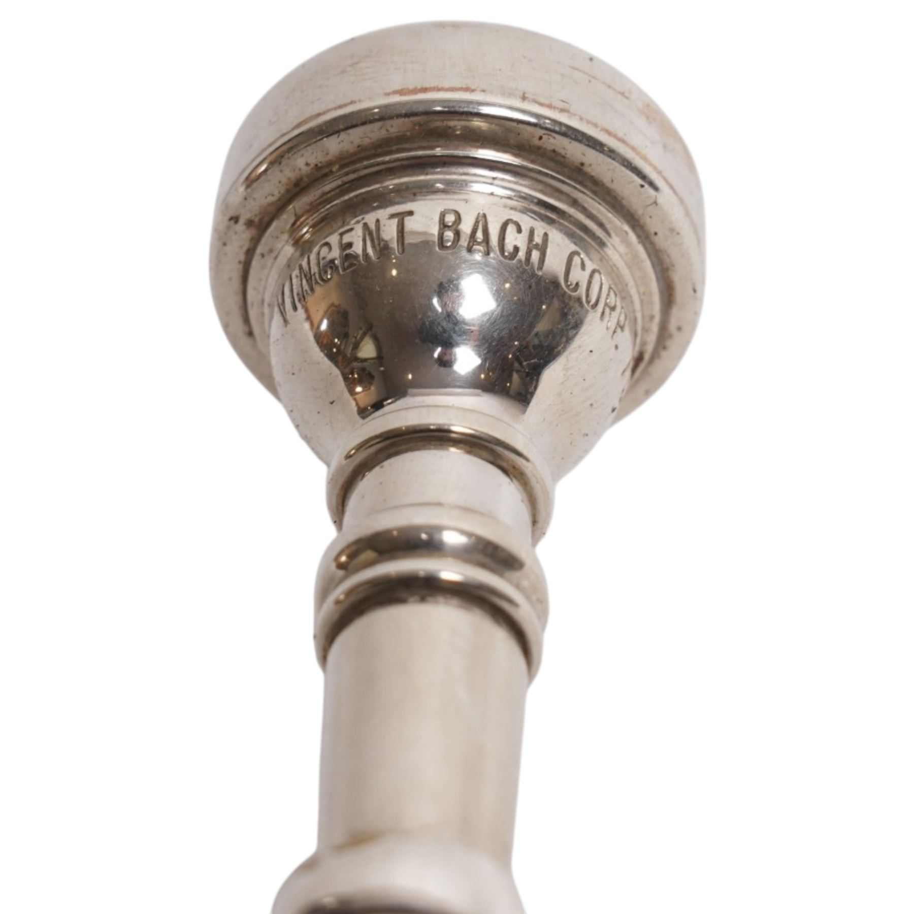 Boosey & Co. (295 Regent Street London) - Late Victorian silver plated sectional coaching horn of tapering form with flared bell, the mouthpiece stamped Vincent Bach Corp 7C surmounting the long tube with two ferrules, stamped to the bell with serial no. 39065, L128cm; with associated leather sleeve case