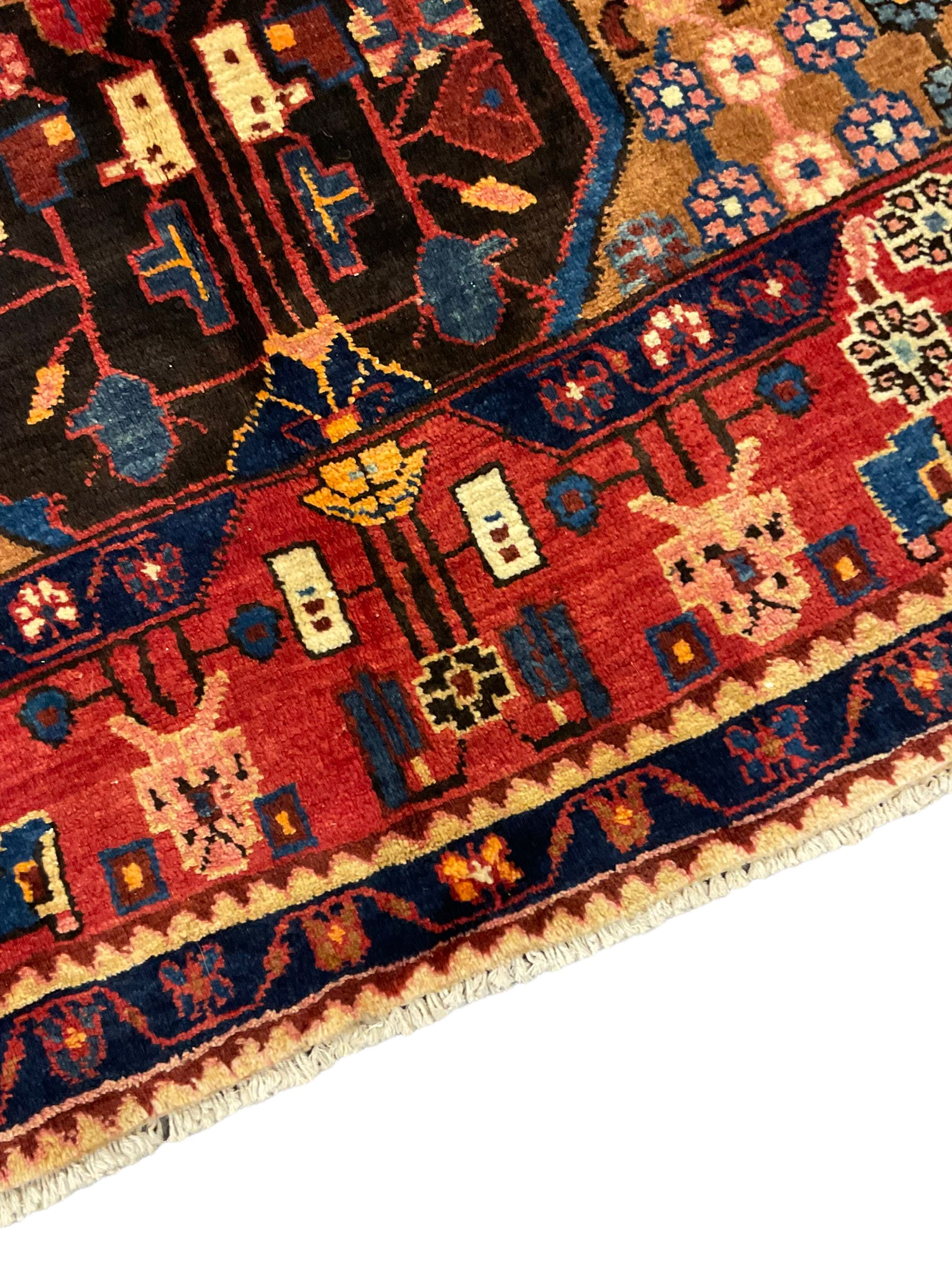 Persian Nahawand rug, central medallion in a field decorated with plant