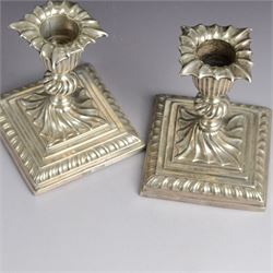 Early 20th century silver pill box, of circular form with pink guilloche enamel lid, hallmarked Deakin & Francis, Deakin & Francis Ltd, Birmingham 1911, together with a commemorative Queen Victoria belt buckle, and a pair of late Victorian dwarf candlesticks with weighted bases, all hallmarked, box D4cm