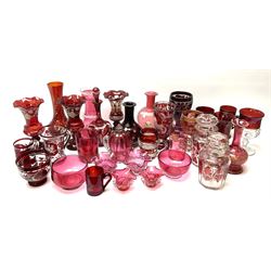A group of 19th century and later cranberry and ruby glassware, including a small number of Bohemian examples, to include various vases, lidded jars, drinking glasses, etc. 