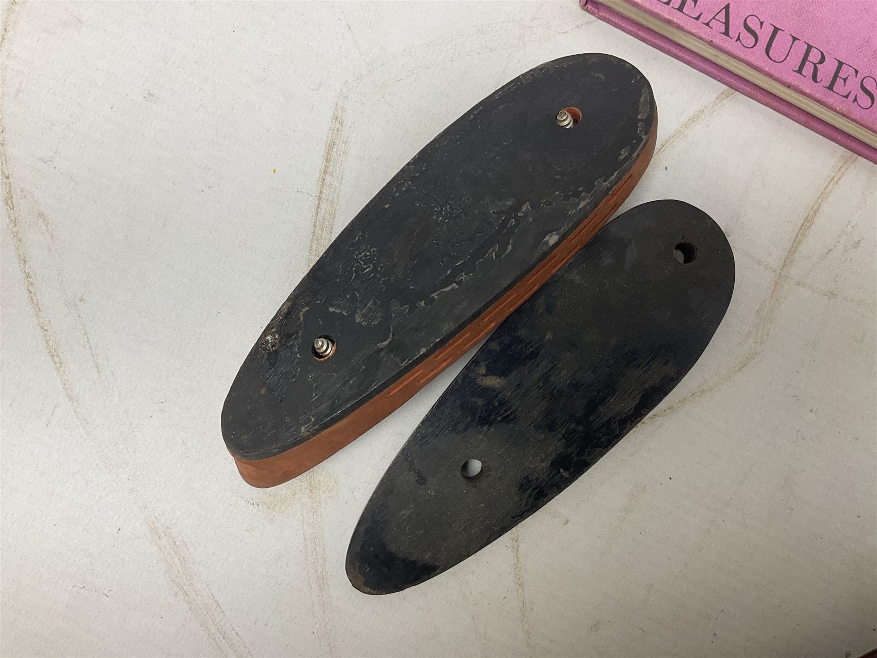 George V 1897 pattern Infantry officers sword, the 82cm single fullered blade with traces of etched detail and George V crown cipher, the ricasso marked Hawksworth Sheffield, pierced half basket hilt with George V cypher, wire-bound fish-skin grip with brass pommel and backstrap; in leather scabbard L102cm overall; together with two sectional gun cleaning rods; swagger stick made of leather strips etc