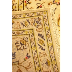  Persian ivory ground Kashan rug, star and flower field and border, 298cm x 210cm  