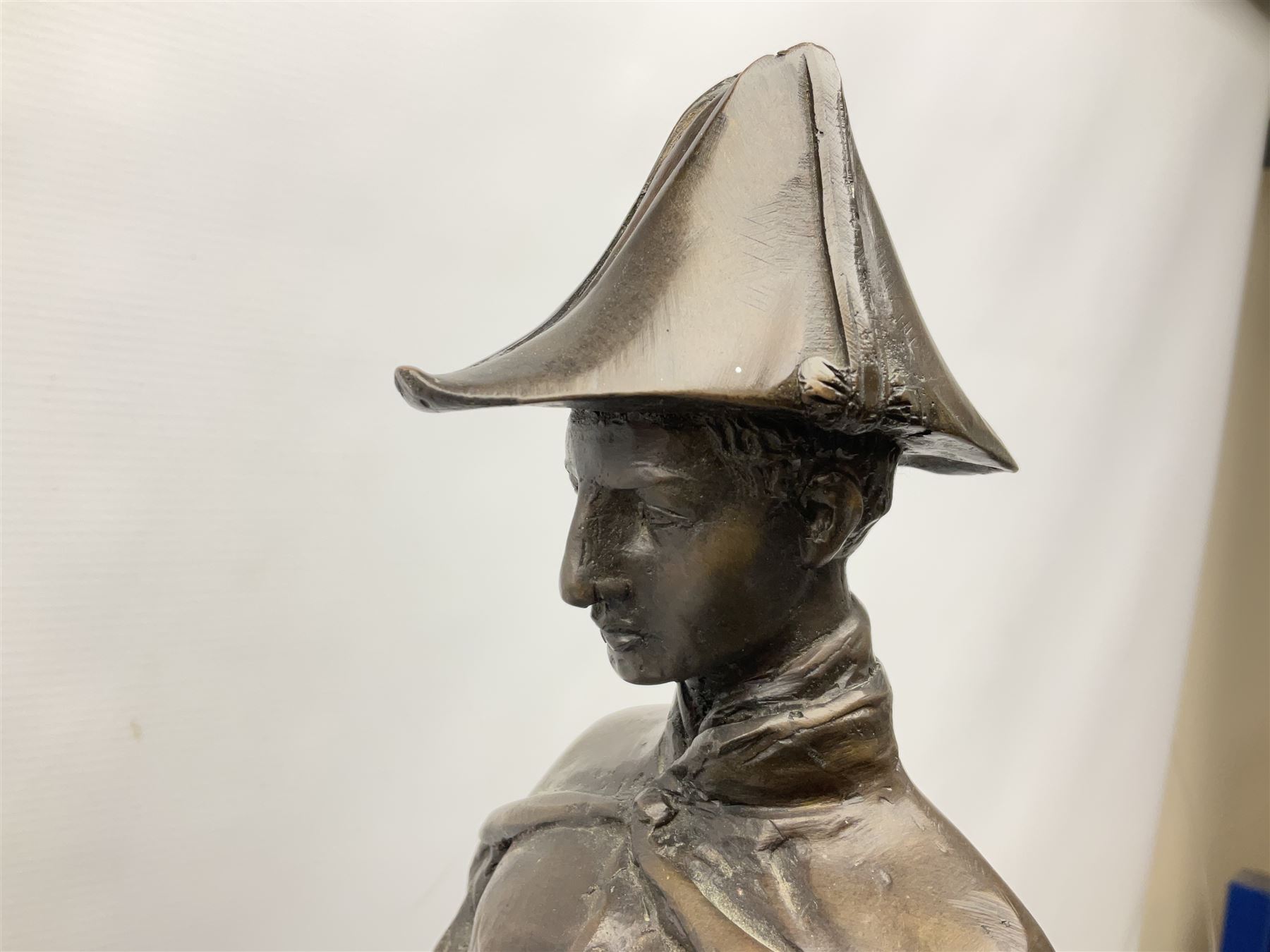 Large and impressive bronze figure of Wellington seated on a horse, on a sarcophogus shaped stepped base impressed 'Meunier Paris', the canted corners inset with battle trophies H68cm L50cm D22cm