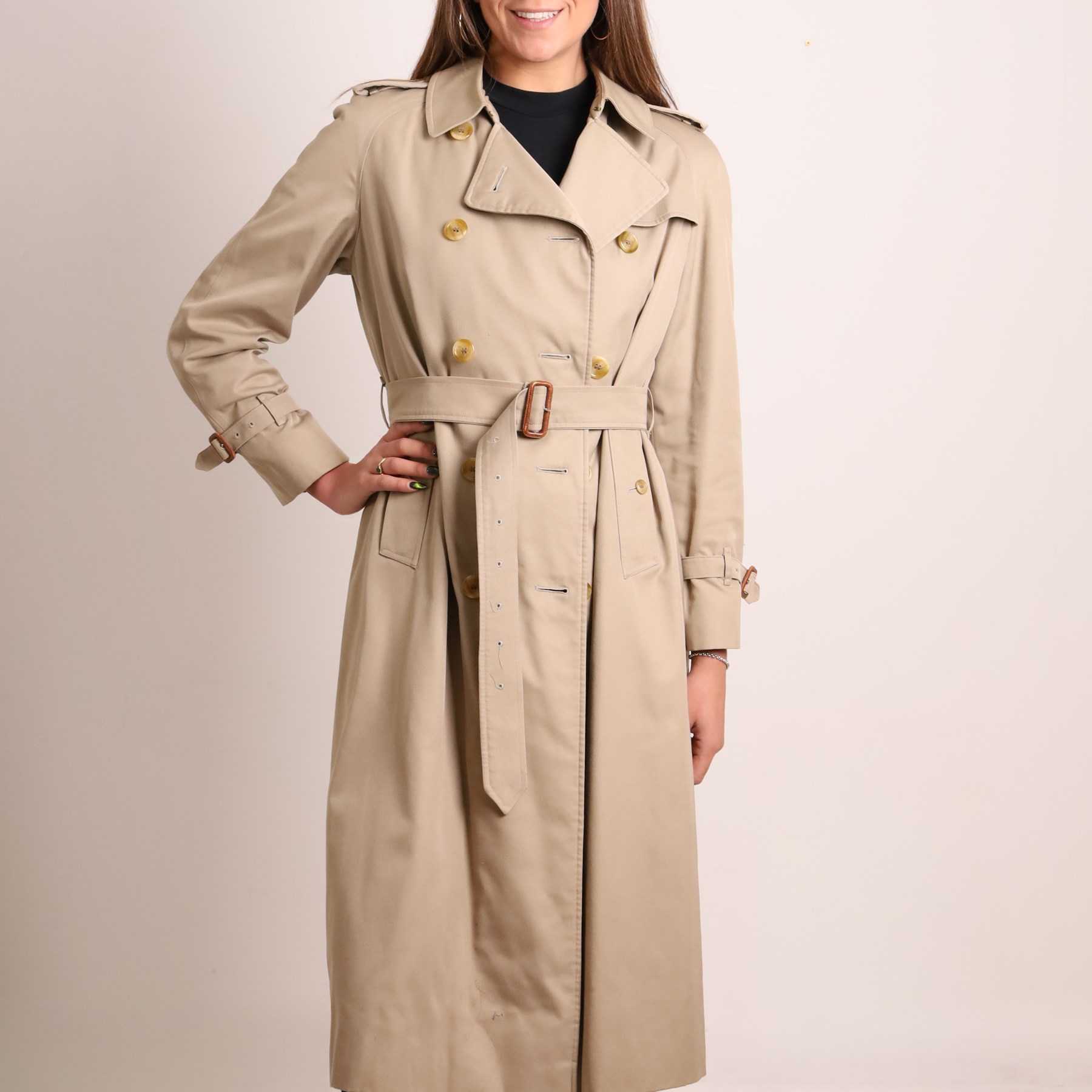 Burberrys - vintage beige cotton gabardine trench coat, double-breasted with button fastening, storm flaps, epaulettes, buckled cuff straps and detachable waist belt, lined in signature Nova Check, labelled Burberrys, Made in England, size M/L