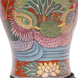 Table lamp of baluster form, decorated with ducks and lilies upon a red ground upon a circular wooden base, H64cm