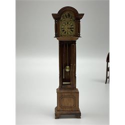 Collection of miniature dolls house furniture and accessories, to include long case clock, chest of drawers, tiled wash stand, ceramics and glass ware, mirror, baskets, etc 