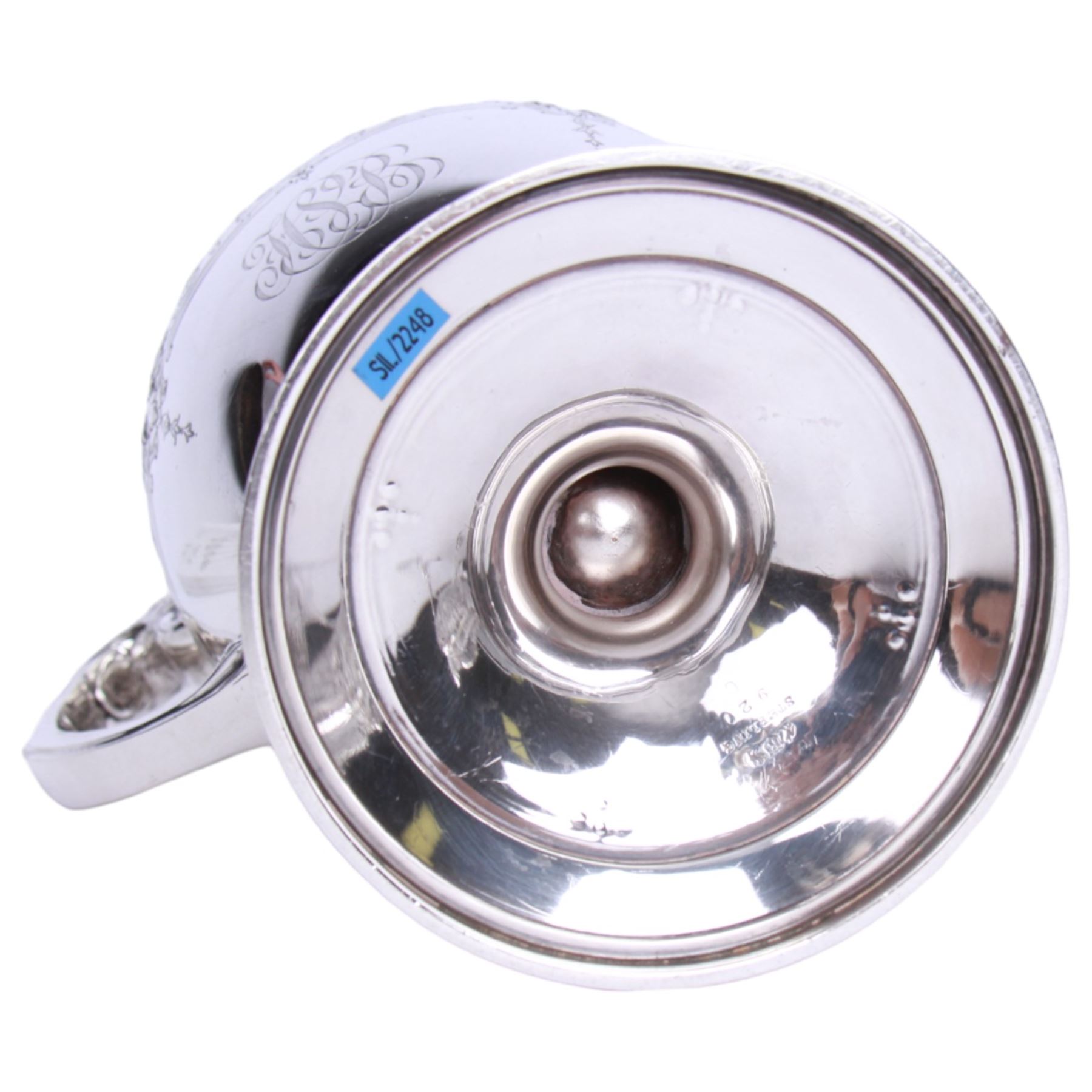 Large late 19th/early 20th century American silver pitcher, the body of ovoid form with embossed and chased foliate band, and acanthus capped scroll handle, upon a spreading circular foot with stiff leaf border, marked for Reed & Barton, Taunton, Massachusetts, and stamped Sterling, H27cm

