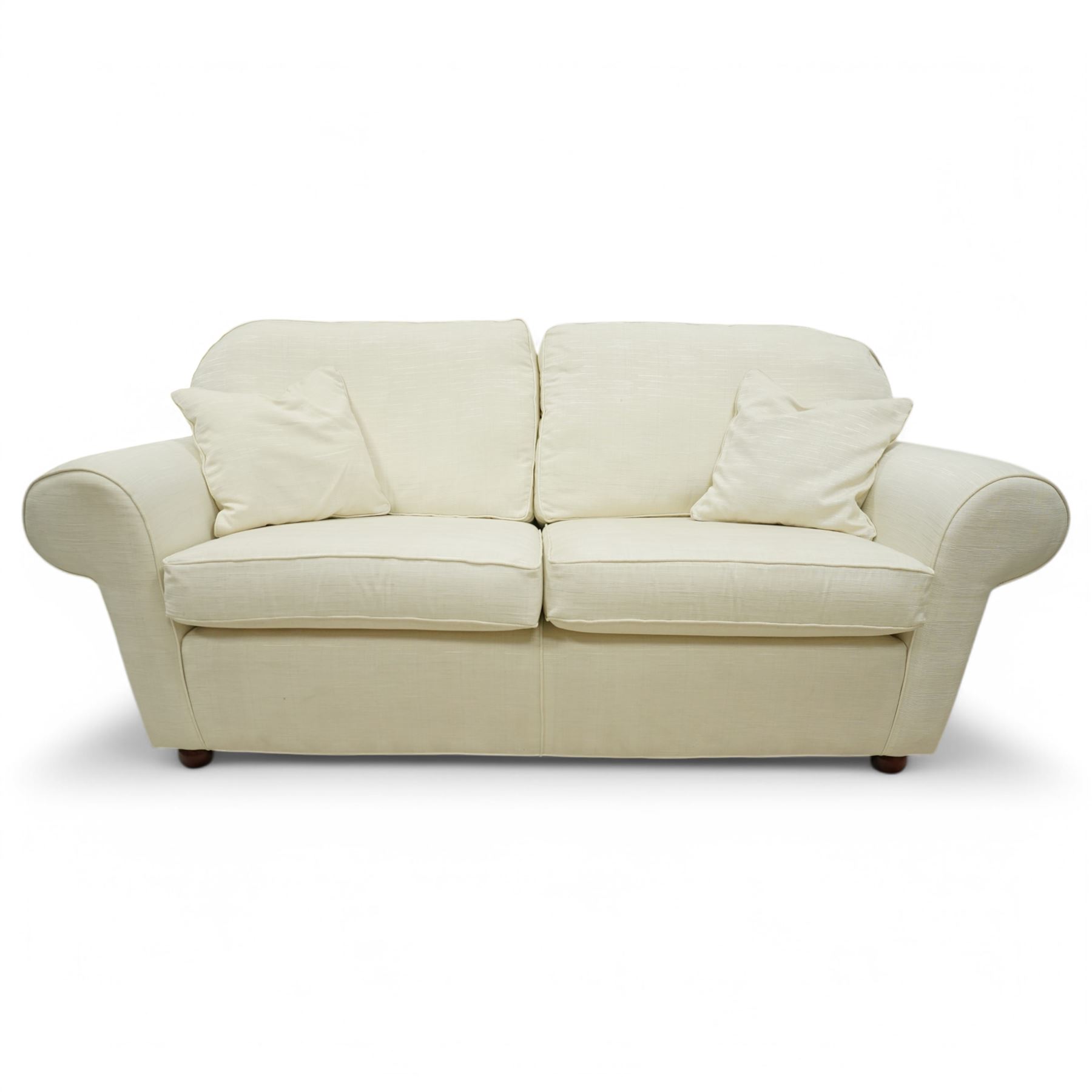Large traditional shape two-seat sofa (W213xm, H101cm, D94cm); together with matching armchair (W116cm); and footstool (53cm x 78); upholstered in cream textured fabric