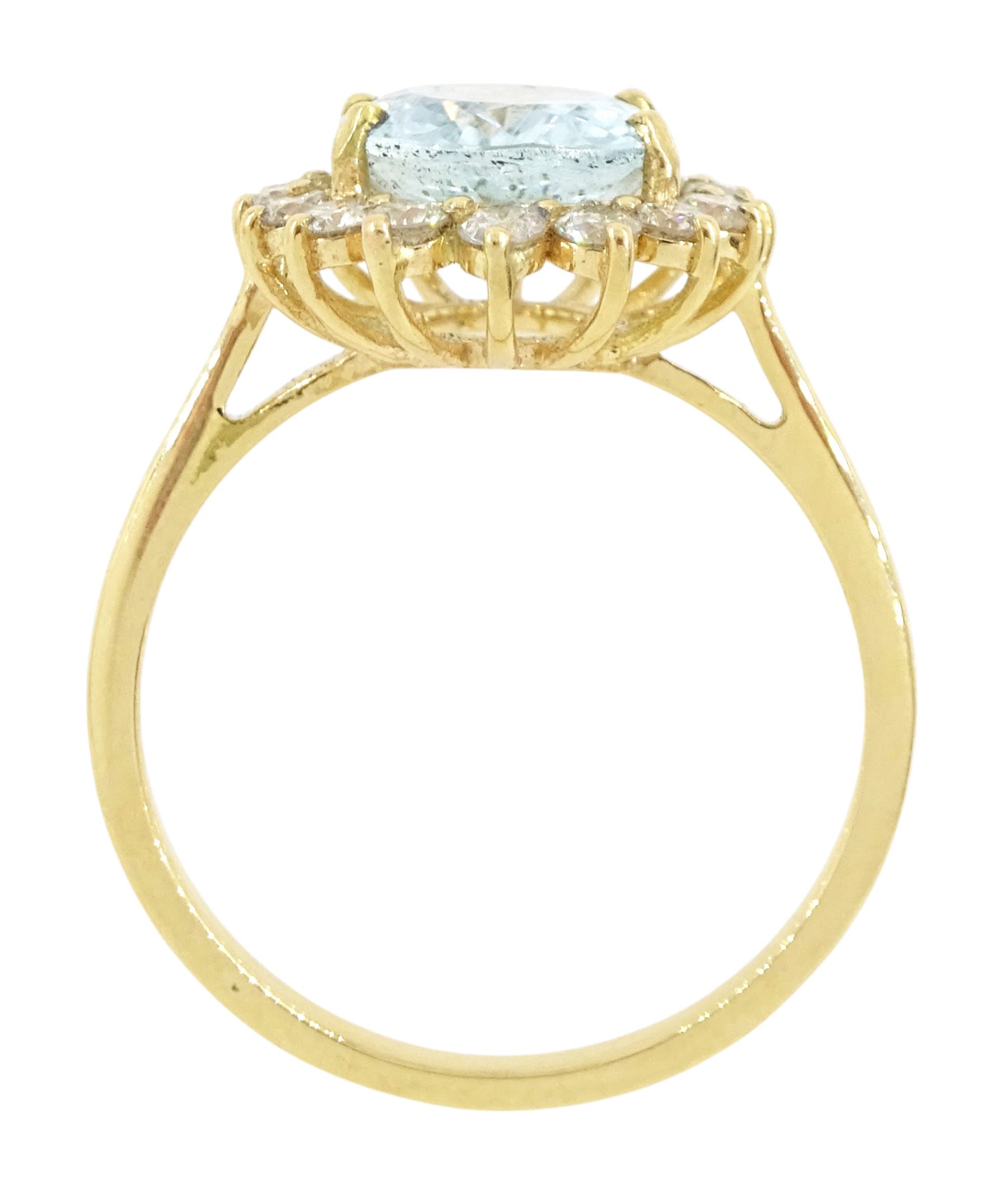 18ct gold aquamarine and diamond cluster ring, single oval cut aquamarine of approx 2.05 carat, with sixteen round brilliant cut diamond surround, stamped, total diamond weight approx 0.40 carat