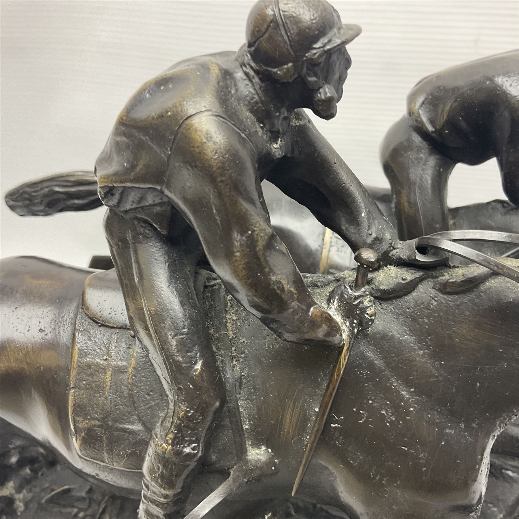 After E Loiscay, bronzed figure group, modelled as two race horses, signed E Loiscay, upon a stepped marble plinth, overall H28cm