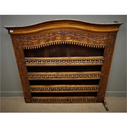  19th century walnut Delft rack, arched moulded projecting cornice, floral, acorn and bell carvings, brass studs, four shelves, W147cm, H136cm, D31cm  