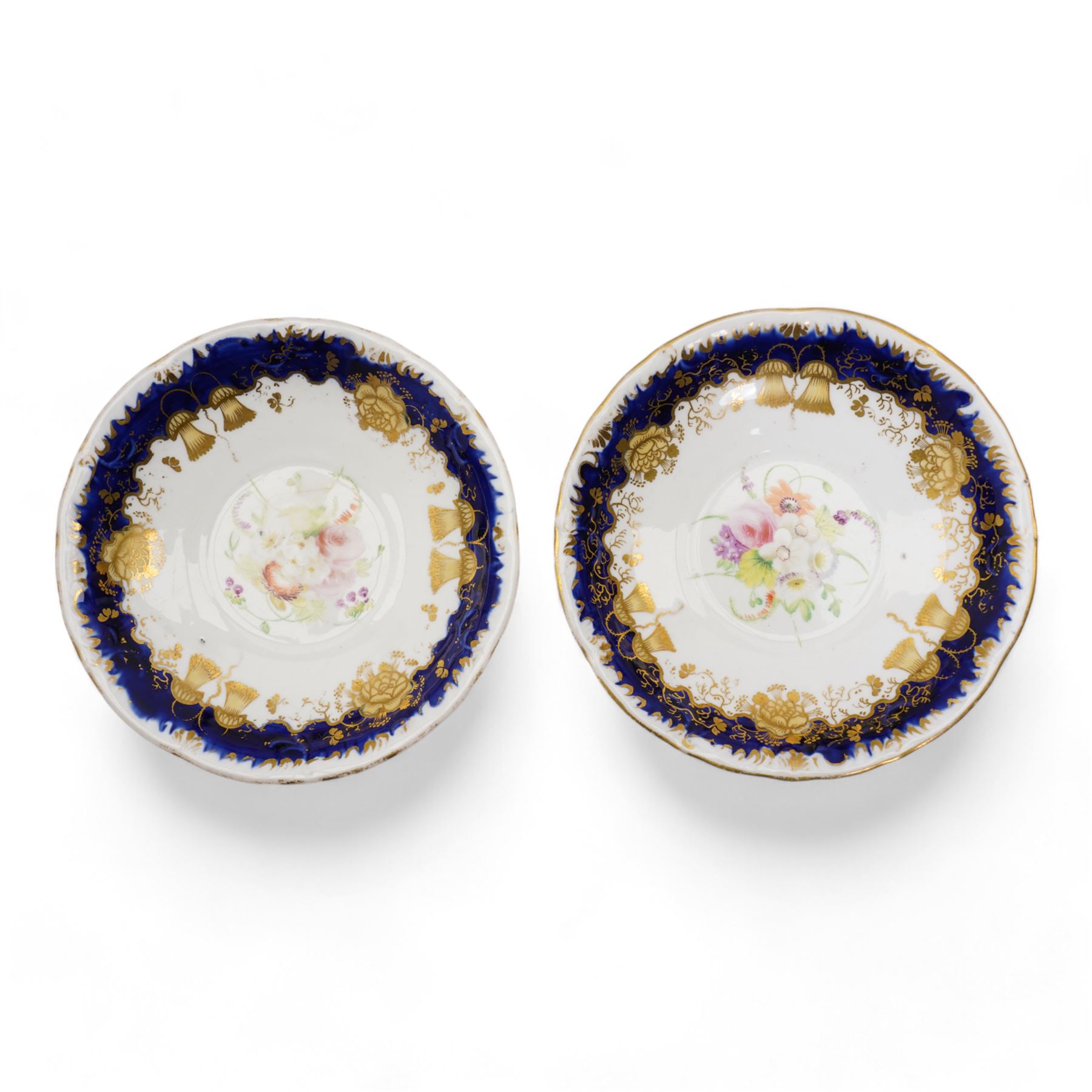 19th century porcelain part tea service, probably Spode, comprising sucrier, milk jug, sandwich plate, seven cups and two saucers, decorated with floral sprays, within cobalt blue and gilt borders, pattern no. 735 