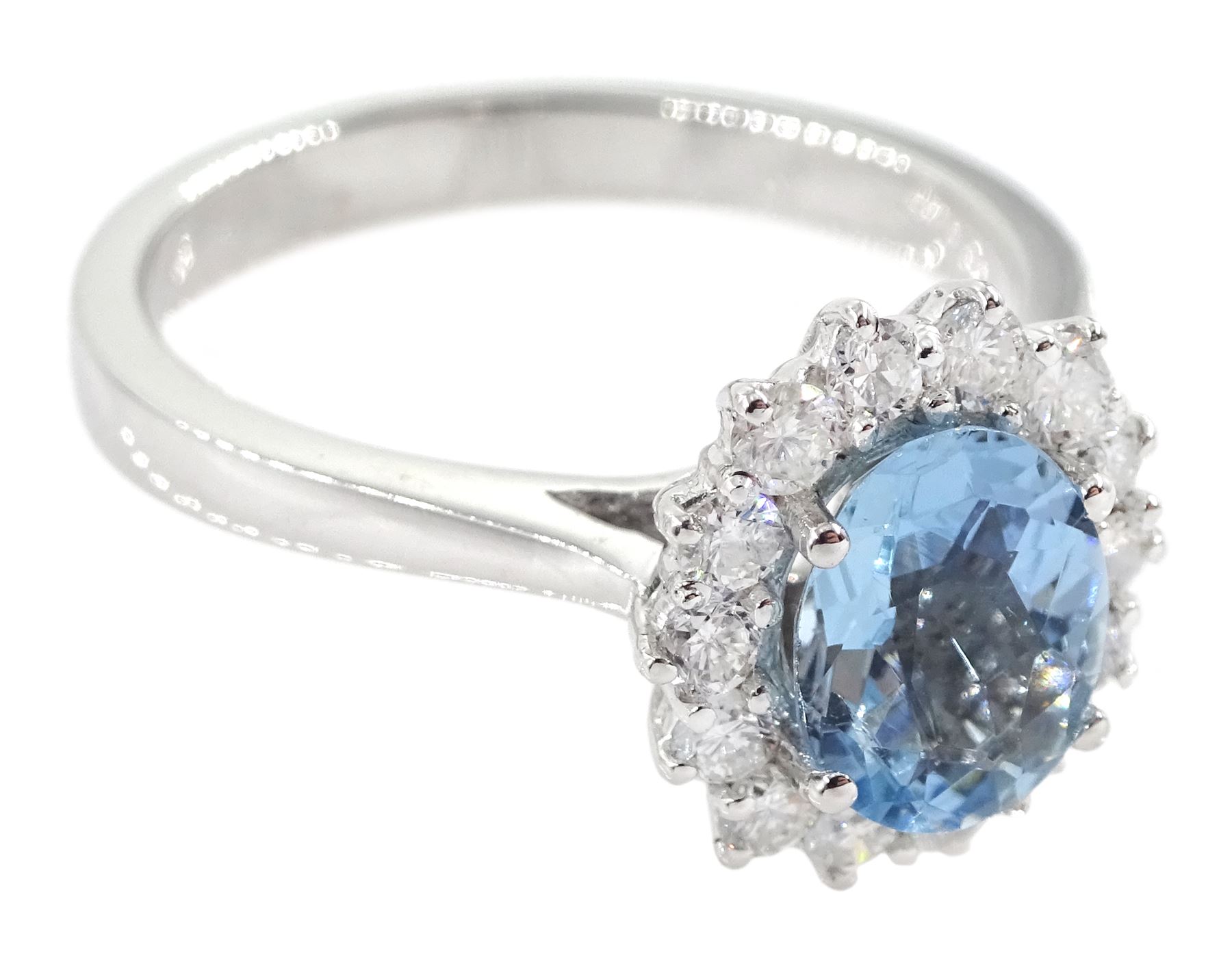 18ct white gold oval aquamarine and round brilliant cut cluster ring, hallmarked, aquamarine approx 1.05 carat, total diamond weight approx 0.40 carat