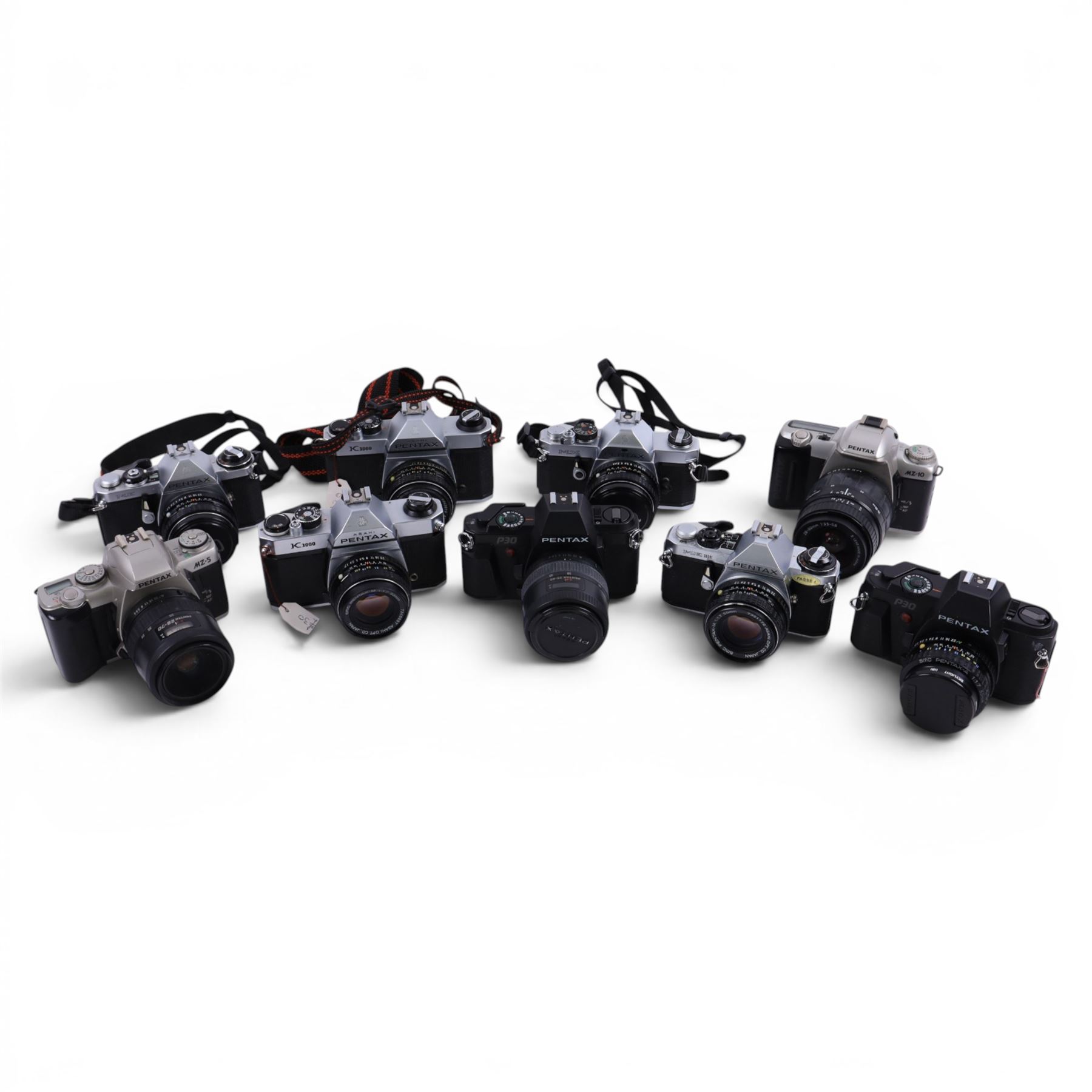 Nine Pentax cameras, including MX, MZ-5, ME Super, P30, etc all with lenses