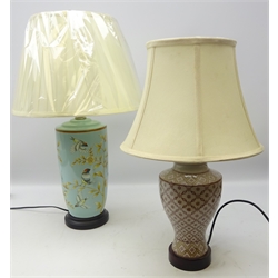  Oriental style ceramic table lamp of cylindrical tapered form decorated with birds amongst foliage, H33cm and an Eastern style ceramic table lamp, both with shades, as new (2)  
