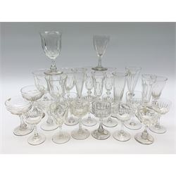 A group of Victorian and later drinking glasses, a number with slice cut decoration, to include various flutes, four goblets marked beneath Webb, etc.