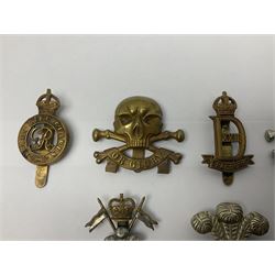 Nine Lancers metal cap badges including 9th, 12th Royals, 24th, 16th Queens and 17th; together with eight various Guards/Dragoons badges (17)