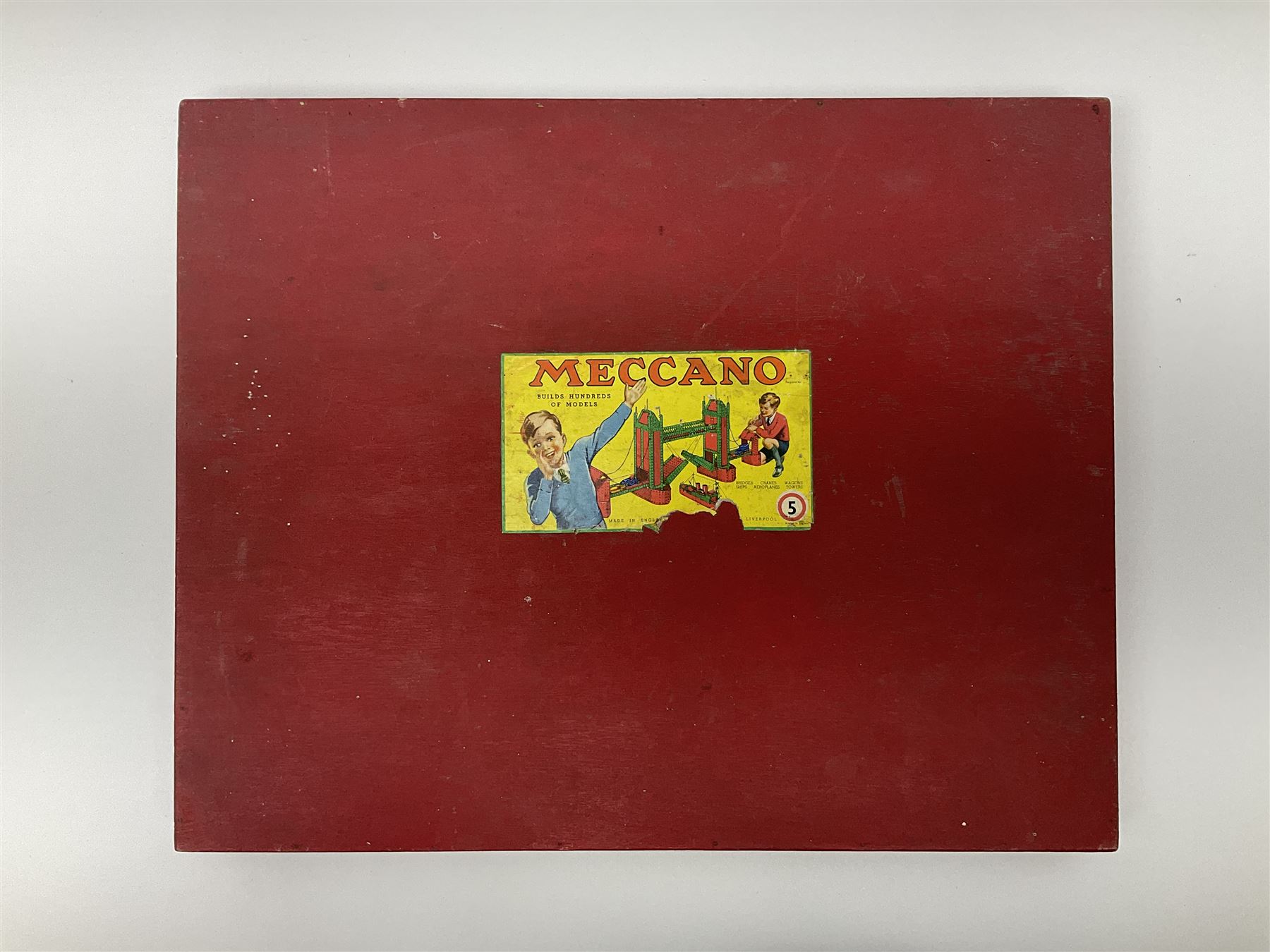 Meccano Set No.5 wooden box containing quantity of predominantly red and green sections, parts, brackets, wheels etc and instruction booklet