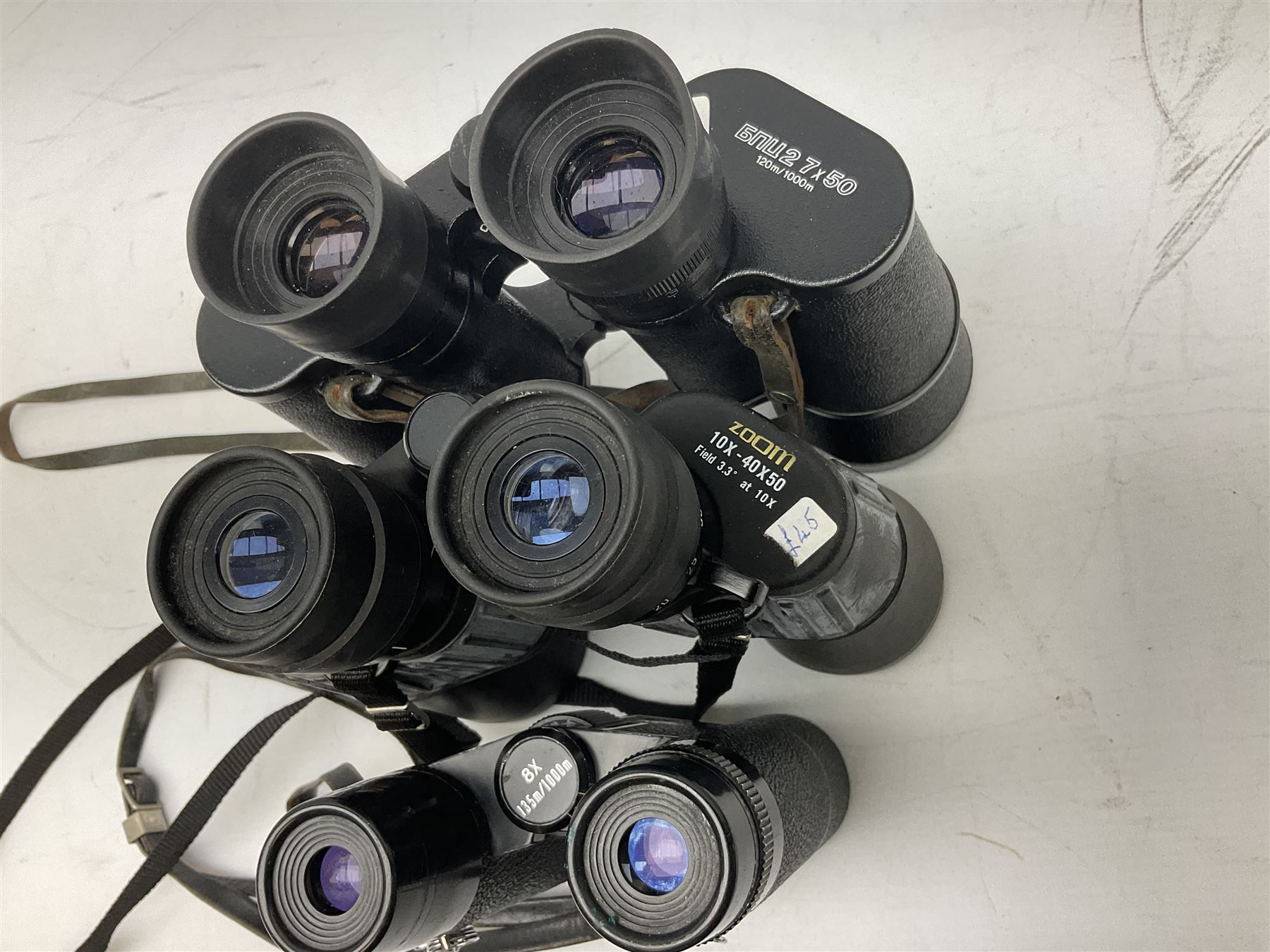 Eleven pairs of binoculars to include Lieberman & Gortz 20x65, Stem (USSR) 7x50, Helios 10x50 Field, Prinz 12x50, Tasco 8x40, Tasco 10x50, etc