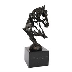 Stylised bronze model of an openwork horses head, signed Gadi and with foundry mark, raised upon black marble plinth, H41cm