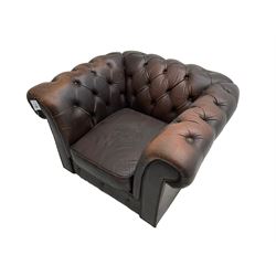 Mid-20th century Chesterfield armchair, upholstered in buttoned chocolate brown leather with studwork border, on castors