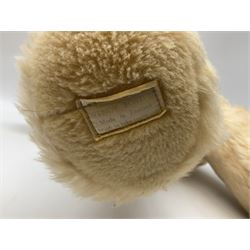 Mid-20th century English plush covered woodwool filled dog with vertically stitched nose and mouth L39cm; and Wendy Boston plush covered teddy bear, the fixed head with applied eyes and vertically stitched nose and mouth H63cm (2)