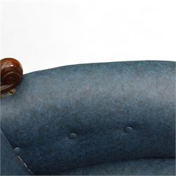 Fine pair of mid-19th-century mahogany library armchairs, carved frame with balloon-shaped back with scrolled ends, rolled wide arms, ending in a scrolled volute above a serpentine seat rail, upholstered in mottled turquoise faux leather, button upholstered back, arms, and cushion seat, studded sides and apron, raised on scroll carved front feet and splayed rear legs on castors 