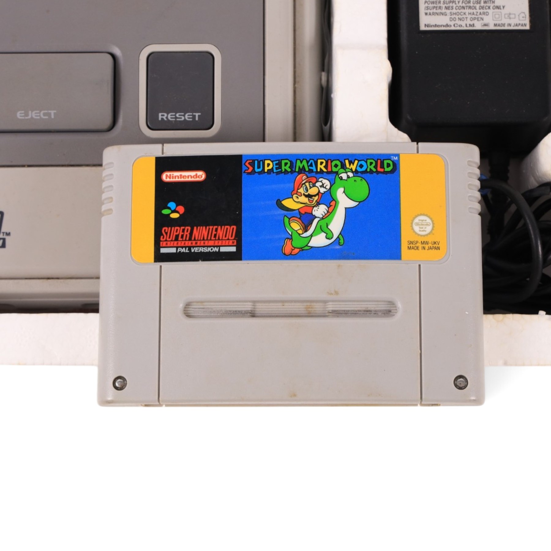 Super Nintendo Entertainment System Pal Version, comprising Super NES Control Deck, Super Mario World Game Pack, two controllers, aerial switch box and AC adapter, boxed
