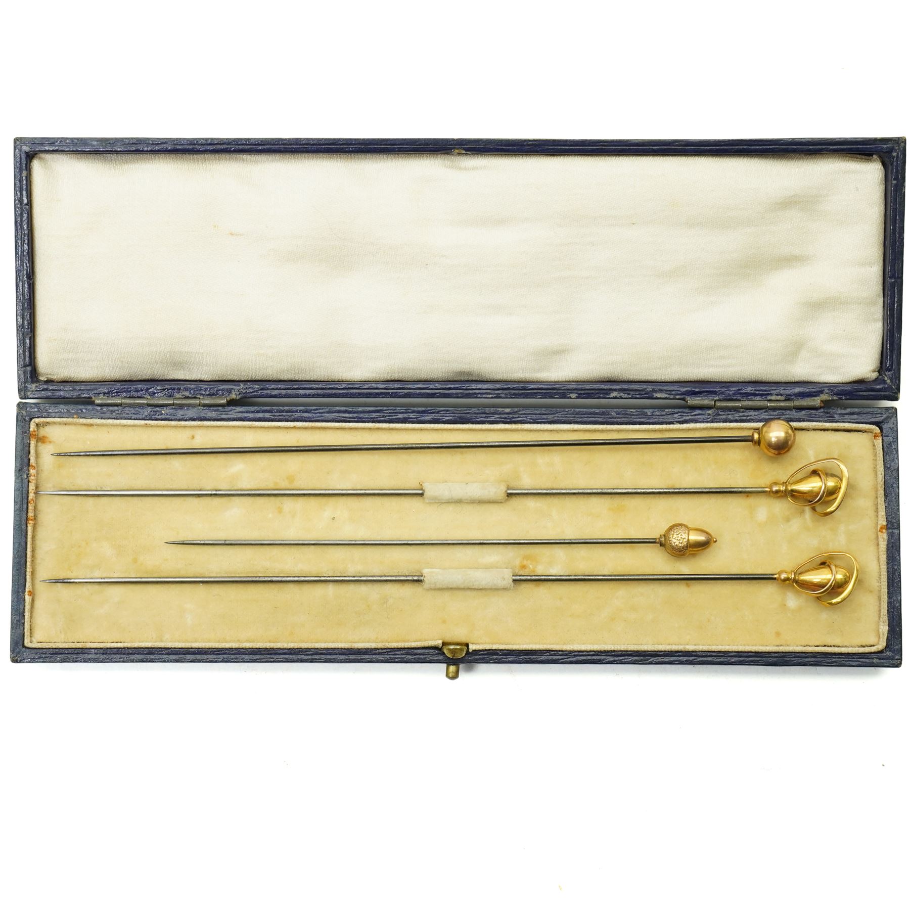 Four early 20th century 9ct gold mounted hat pins including an acorn, ball and cased pair by Charles Horner