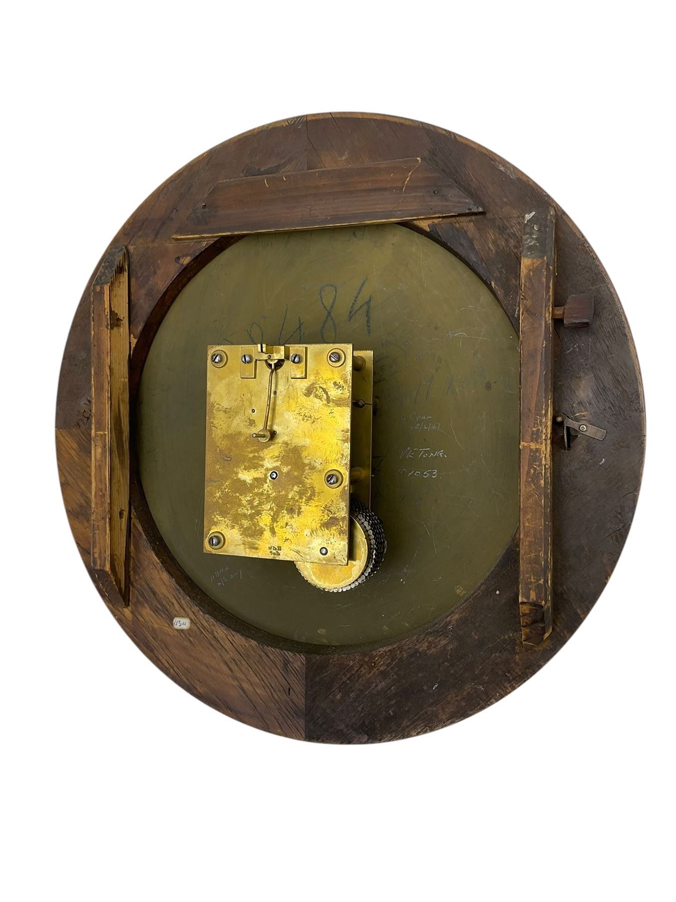 Winterhalter and Hoffmeier -  German oak cased early 20th century fusee wall clock, with a circular wooden surround and a spun brass glazed bezel to the dial, housed on an integral carved bracket with shaped corbel supports, painted dial with Roman numerals, minute track and steel spade hands, dial pinned directly to a four pillar chain driven fusee movement with a recoil anchor escapement. With pendulum and key. 
German fusee movements by Winterhalter and Hoffmeier are comparatively rare, especially housed in carved wall clocks of this description. 