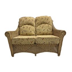 Four piece cane conservatory suite - two seat sofa (W130cm), pair of armchairs (W85cm), and coffee table (85cm x 60cm)