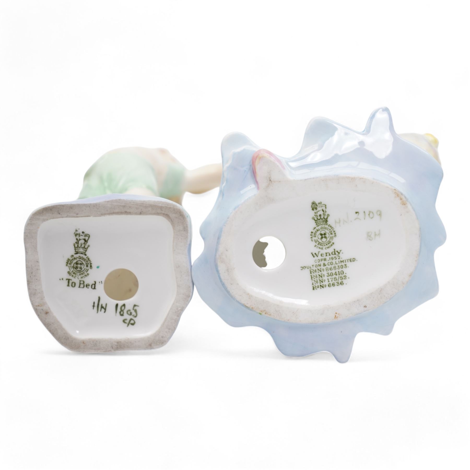 Royal Doulton figure, In the Stocks, HN2163,  H15cm, and four other Royal Doulton figures, To Bed HN1805, Babie HN1279, Wendy HN2109 and Penny HN2328 (second) (5)