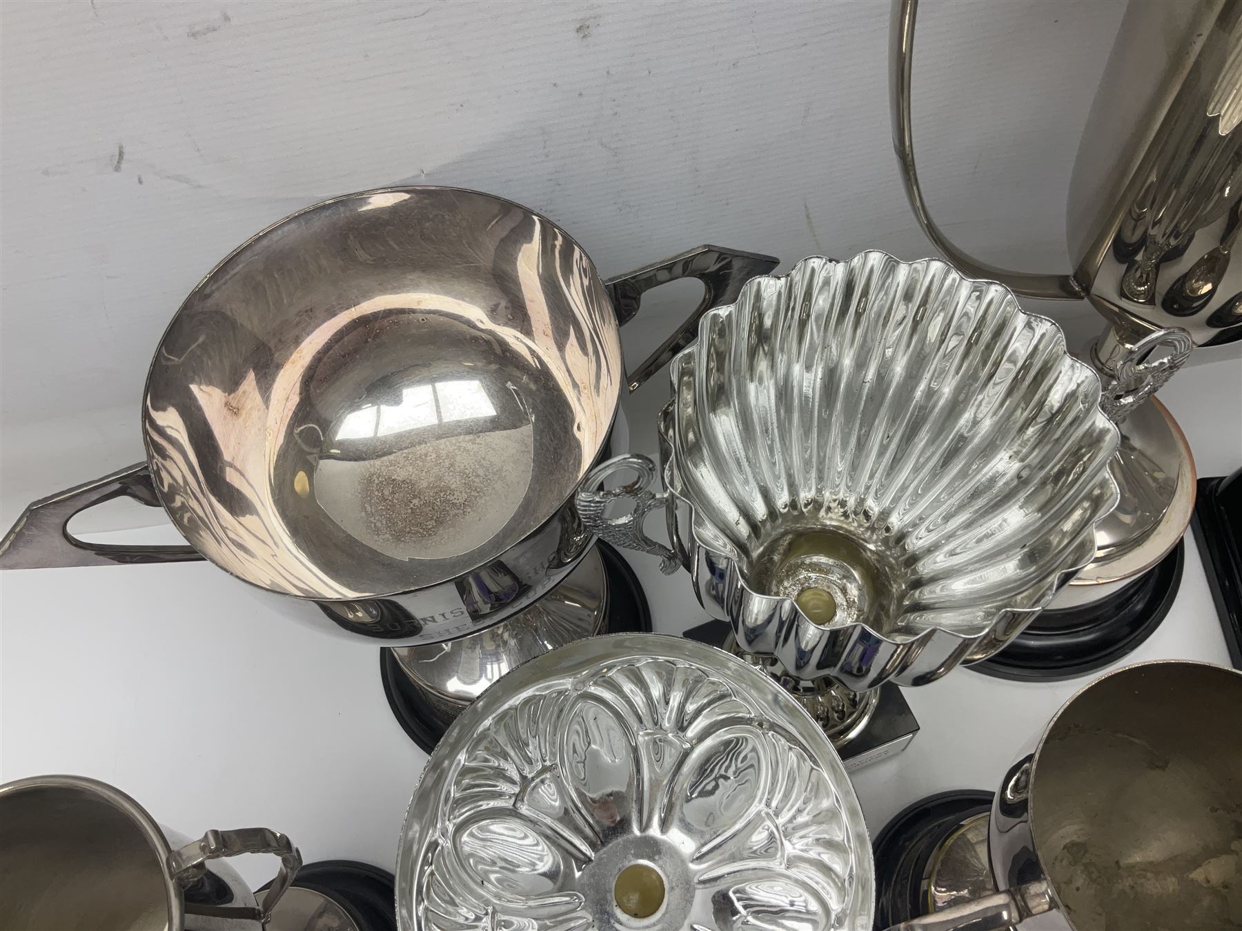 Collection of silver plated and metal trophy cups and winners plaques, all relating to the Burniston and District Show, most engraved with competitions and winner's names, in three boxes 