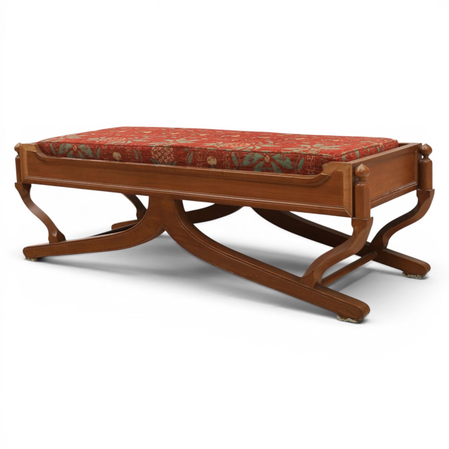 Traditional design teak long foot stool, red patterned seat cushion, on an X-frame base
