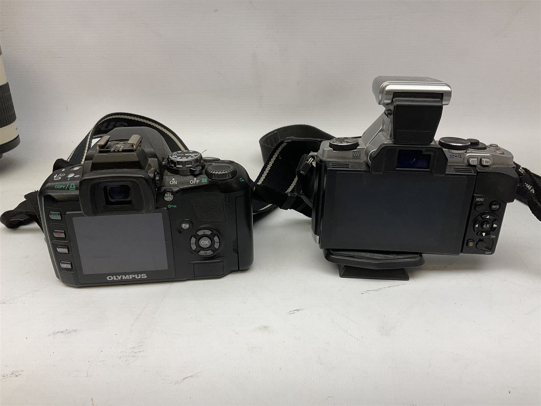 Three Olympus Camera bodies, comprising of OM-D E-M5, E-400 and E-450,   together with 'Samyang Mirror Lens 800mm 1:8.0DX', Olympus 'Zuiko Digital 40-150mm 1;3.5-4.5mm' lens, three other lenses and Velbon CX444 tripod 