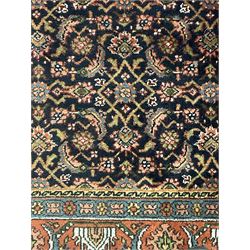 Persian Herati indigo ground rug, the field decorated with repeating Herati motifs, floral design border within guard stripes 