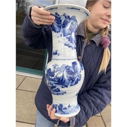 Qing Dynasty Yen Yen blue and white vase in the Kangxi style decorated with a lake landscape surrounded by rocky cliffs, figures in a boat and on the shore H45cm 