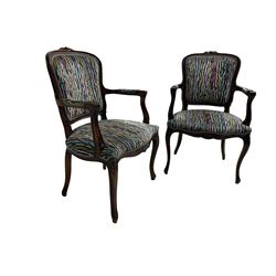 Pair of French design open armchairs, the moulded frame carved with flower heads, upholstered seat, back and arms, on cabriole supports