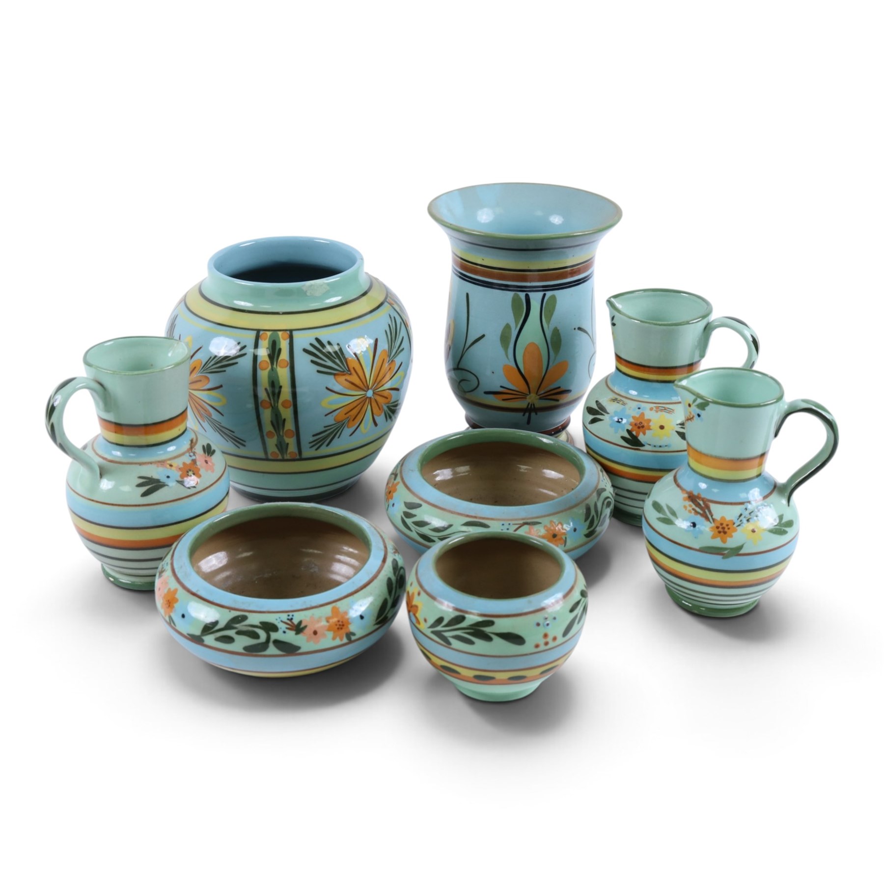 Hartrox Stoneware comprising three jugs, two vases and three bowls, all with green, blue and yellow floral decoration, with printed marks beneath, tallest H20cm