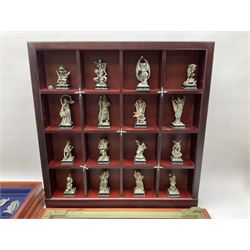 Danbury Mint 'The Fantasy of the Crystal' chess set consisting of mythical pewter chess pieces within a wooden case with chess board lid, together with 16 additional chess pieces in a wooden display case.