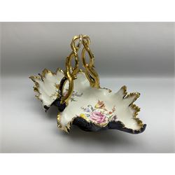 Late 19th/early 20th century Meissen porcelain fruit basket, the moulded leaf shaped bowl entwined gilt foliate handle, cobalt blue exterior and interior hand painted with floral sprays upon a white ground, with underglaze blue crossed swords mark beneath, H26cm W41cm 
