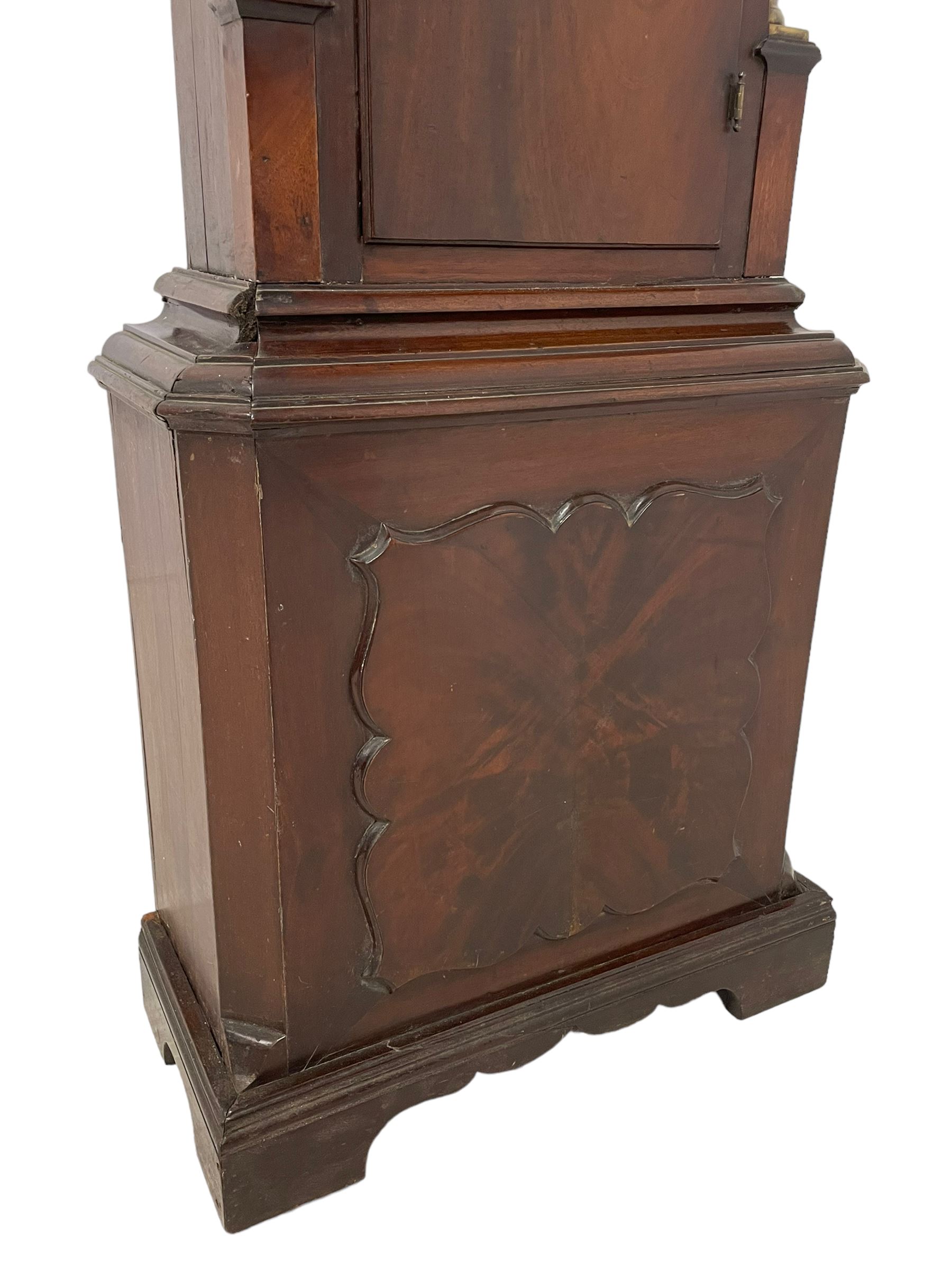 W. Phillips of Bromyard - 8-day mahogany longcase with a painted moon roller dial, c 1790,
swans neck pediment with dog tooth moulding, raised carving and  brass paterie, break arch hood door beneath flanked by reeded pilasters with brass Corinthian capitals, trunk with a blind fret, reeded quarter columns and long wavy topped door,
Plinth with a deep moulding and canted corners raised on a shaped base, painted dial with gesso spandrels, Roman numerals, five minute Arabic's and minute dots, with steel hands, seconds dial and square date aperture, dial pinned to a rack striking movement with an anchor escapement, striking the hours on a cast bell. A clockmaker by the name of John Phillips is recorded as working in Bromyard (Worcs)  in the early to mid 18th century, certainly by 1770-90. W. Phillips was possibly an unrecorded son or brother also working in the same family clockmaking business during the later part of the 18th century.
