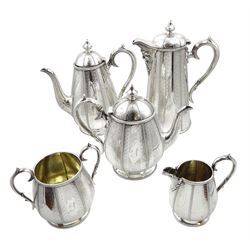 Victorian silver three piece tea service including teapot, sugar basin and milk jug, tapered baluster form, each panel with bright cut decoration separated with embossed beaded borders, by Thomas Bradbury & Sons, London 1867, approx 43.8oz, with an associated silver-plated water jug with mask head and coffee pot by the same maker, dated 1867 & 68, initialled 'P' to each piece