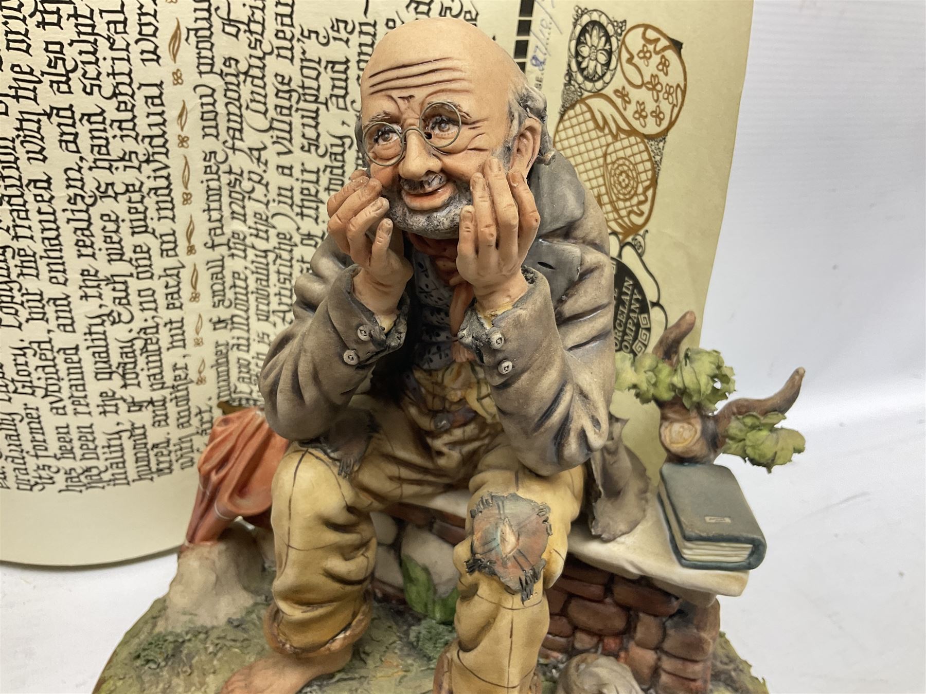 Four Capodimonte figure groups, to include tramp figures, shoemaker figure etc